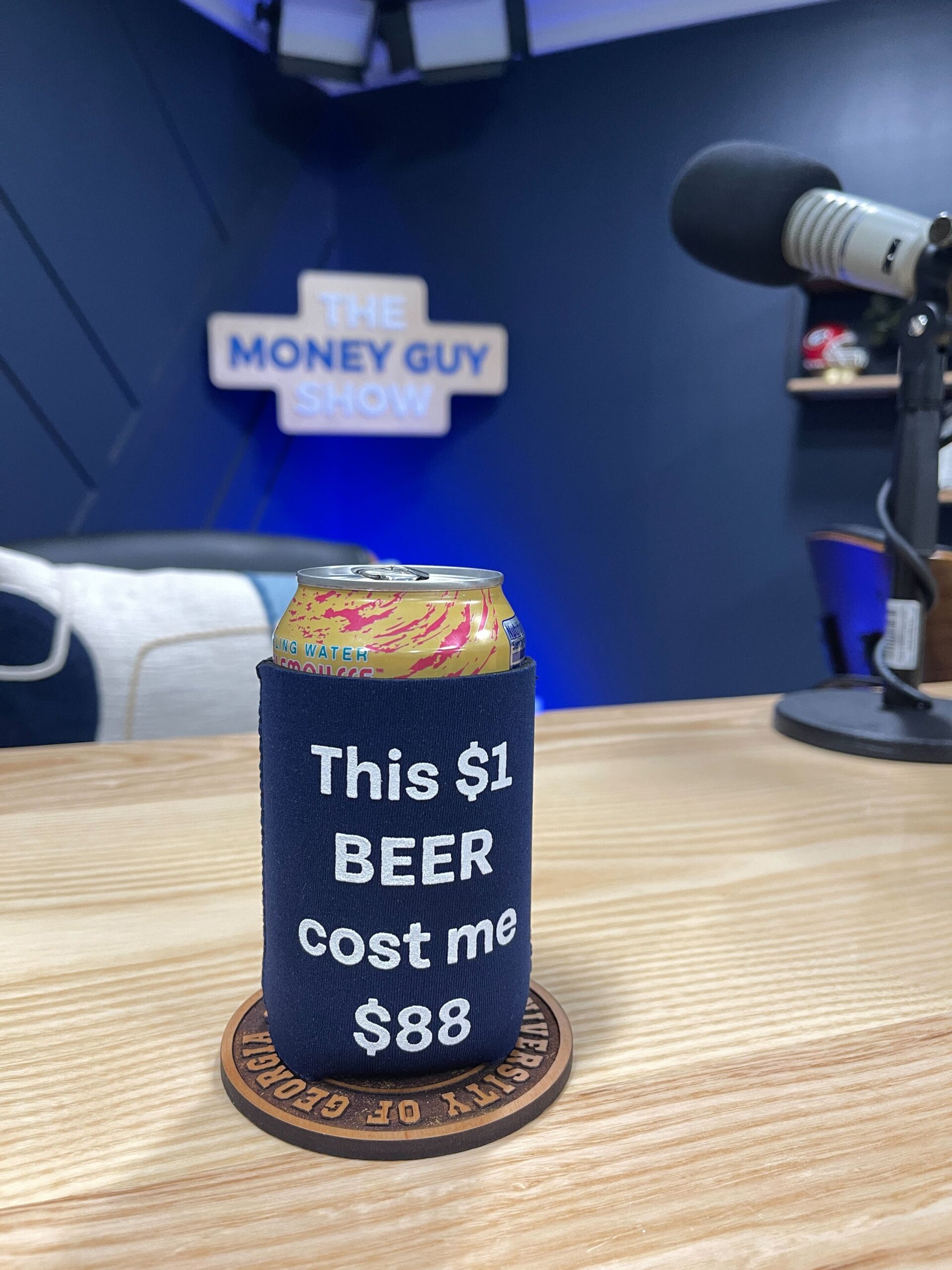 A photo of a La Croix sparkling water in a coozie that says "This $1 Beer Cost Me $88," symbolizing the Money Guy Wealth Multiplier and compounding interest concept.